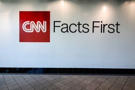 a wall that reads “CNN facts first”