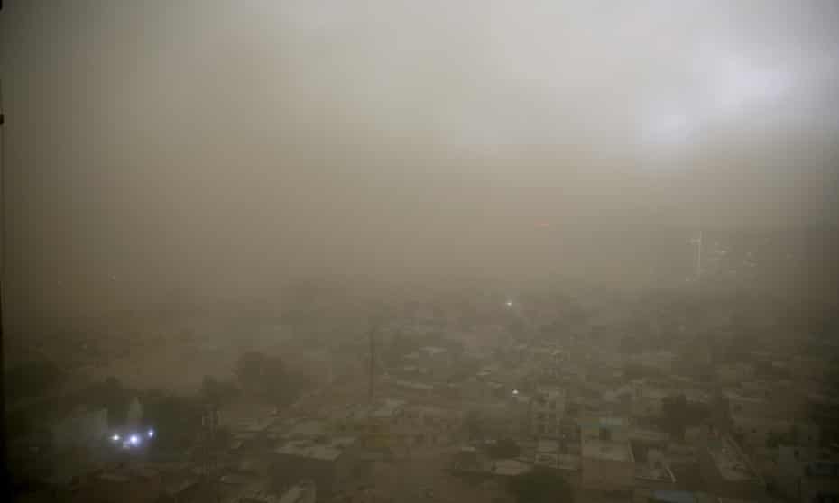 Dust from a storm covers the horizon on the outskirts of New Delhi