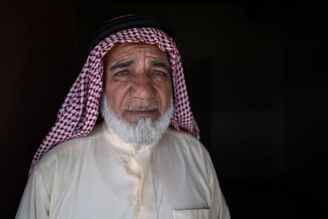 Mahmoud Talib, a 68-year-old man with white beard, wearing a keffiyeh.