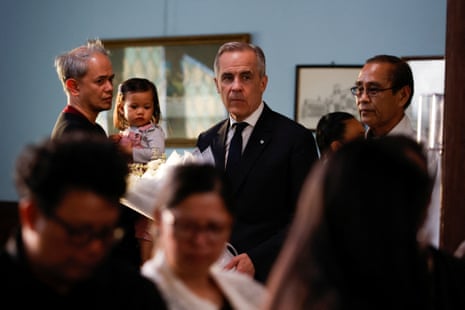 Canada’s Prime Minister Mark Carney carries a bouquet of flowers as he mourns with members of the Filipino community at St. Mary the Virgin South Hill Church, after a vehicle was driven into a crowd at a Filipino community Lapu Lapu day block party, in Vancouver, British Columbia, Canada April 27, 2025. REUTERS/Carlos Osorio
