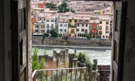 Room with a view: a window of the Archaeological Museum, formerly the monastery of San Gerolamo, frames a view of the city and the Adige river.