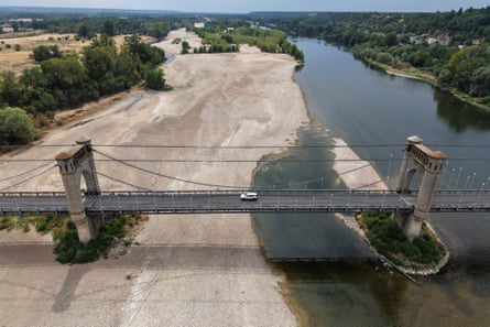 A drone view of a bridge over a sandbank and the Loire River in Langeais near Tours,