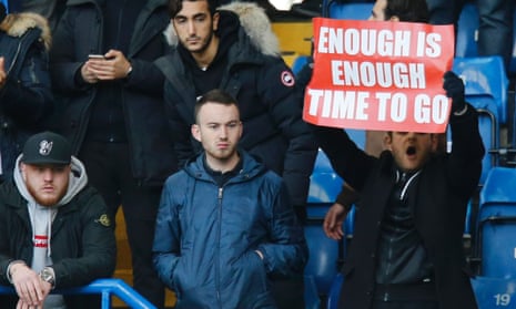 An Arsenal supporter makes his feelings about Arsène Wenger clear during the recent defeat at Chelsea. There was more fan unrest during the 5-1 loss to Bayern Munich