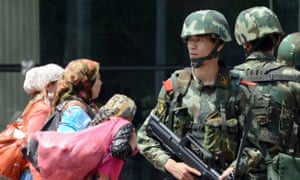 A paramilitary guard in Xinjiang capital Urumqi.