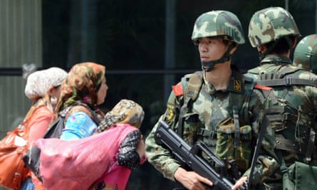 A paramilitary guard in Xinjiang capital Urumqi.
