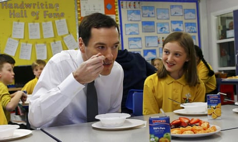 George Osborne visits a primary school the day after announcing in his budget speech that all schools in England will become academies by 2020.