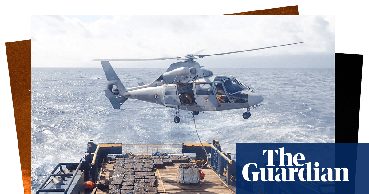 A hovering helicopter and a winter whiteout: photos of the day