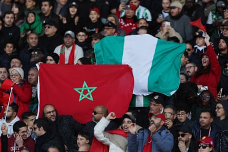 Fans holding up flags in the stands