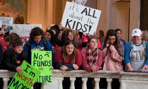 Kids join the teachers’ rally at the state capital on Wednesday.