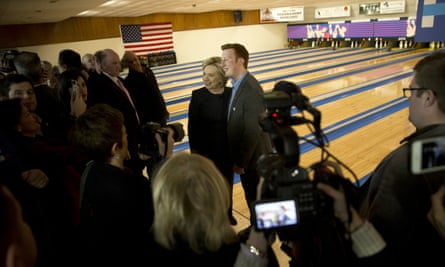 Hillary Clinton poses for photos with Bryce Smith at a campaign event at Adel Family Fun Center.