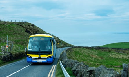 The 350 bus labours uphill at the Cliffs of Moher.