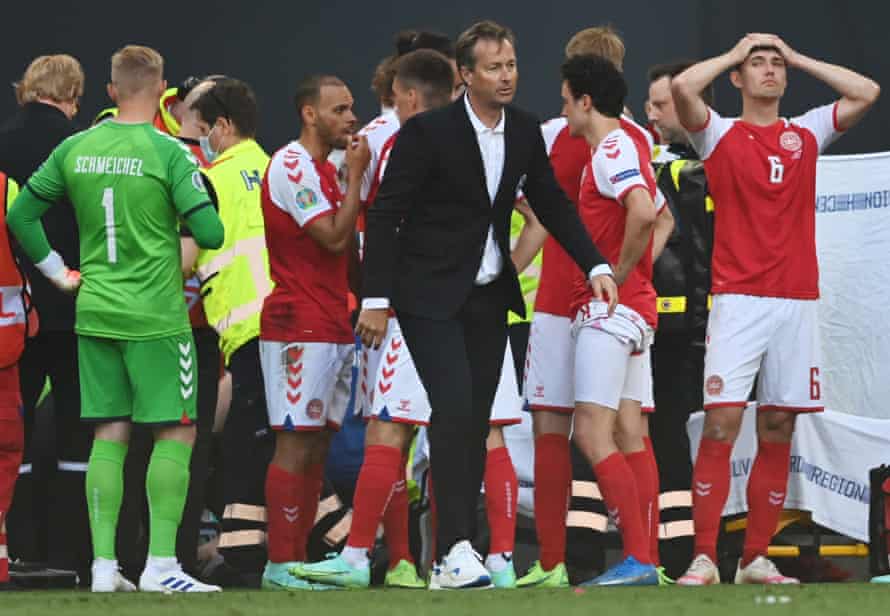Denmark’s Kasper Hjulmand: ‘It’s been an emotional year. A horror film but also a fairytale’ | Denmark 2 Kasper Hjulmand on the pitch as Christian Eriksen receives medical assistance during the between Denmark and Finland.