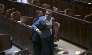 Jamal Zahalka, an Israeli Arab politician, is removed from the Knesset in protest