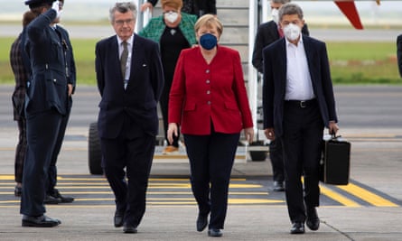 Germany’s Chancellor Angela Merkel and her husband, Joachim Sauer arrive