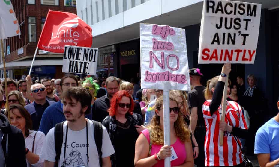 Demonstrators hold up placards during anti-fascist demonstration in Southampton