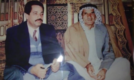 Wathik Showkat, left, sits with his father Showkat Abdullah al-Mashhdani, who was killed by US troops outside his Baghdad house on 26 July, 2007.
