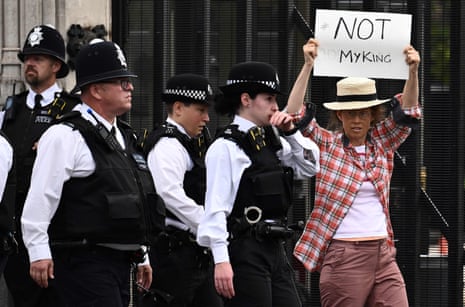 Police moved on a protestor in London after the death of the Queen