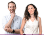 Composite of Mike and Caterina, both smiling, him on left with hand on chin wearing a pale shirt, her with hands in pockets wearing a cream waistcoat
