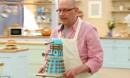 Great British Bake Off contestant Rob Smart with a Dalek cake.