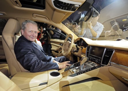 A man sitting inside a Porsche