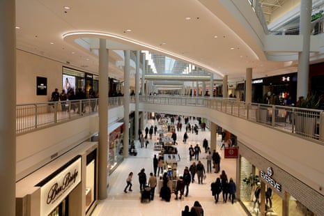 Shoppers walk through the multi-level Mall of America, with stores lining both floors