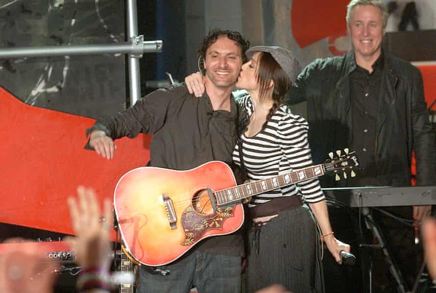 Madonna kisses Mirwais Ahmadzaï while showcasing songs from American Life in New York, 2003.