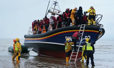 A group of people thought to be migrants are brought in to Dungeness, Kent, by the RNLI