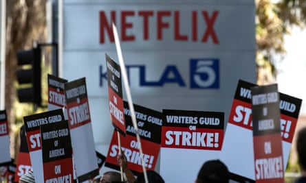 Members of the Writers Guild of America (WGA) demonstrate in front of the Netflix building in Los Angeles, California.