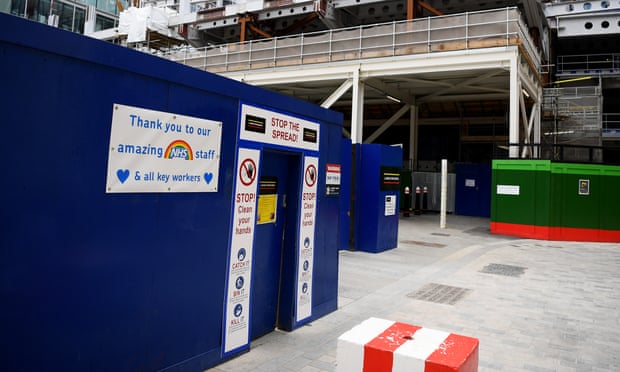 Safety signs and a thank you message to the NHS at a construction site in London