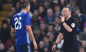 Kevin Friend prepares to show John Terry a red card for a foul on Peterborough’s Lee Angol.