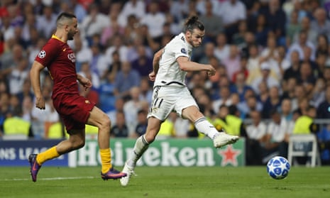 Gareth Bale drives in Real Madrid’s second goal during their comfortable Champions League win against Roma. 