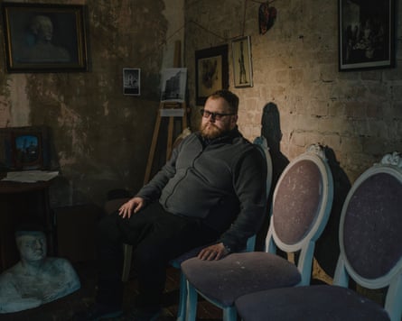 Anatolii Pohorily sitting in a house.