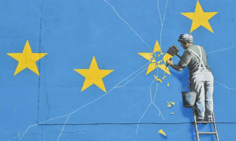 A mural by British artist Banksy depicting a worker chipping away at one of the stars on a European Union flag.