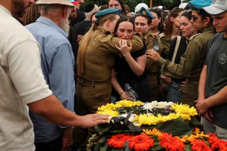 Friends and family of an Israeli soldier mourn at a funeral held 20 May in Netanya, Israel, 20 May.