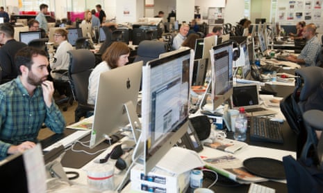 People working on computers in the Guardian newsroom
