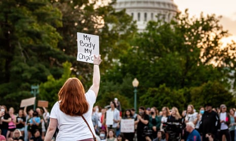 A protester holds a pro-choice sign during a demonstration at the supreme court on Wednesday.
