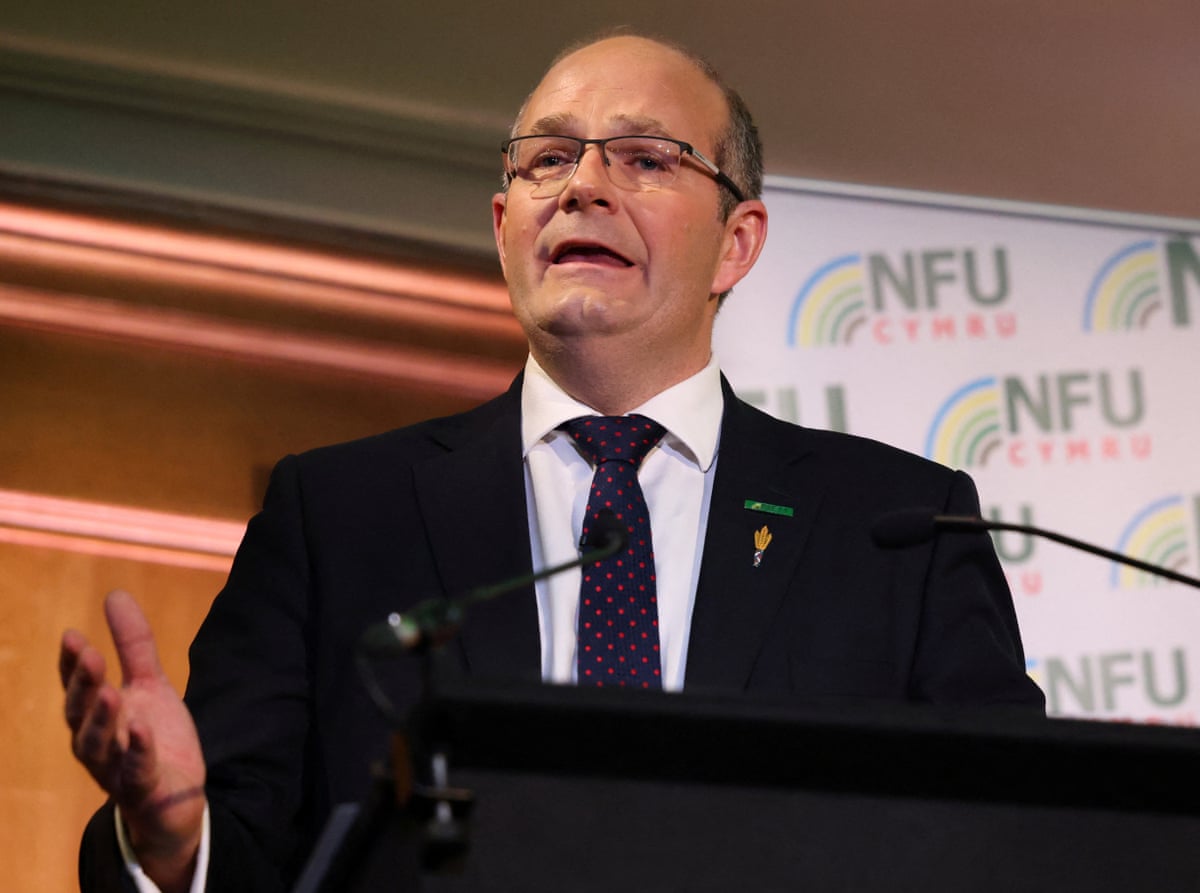 Tom Bradshaw, NFU president, speaks into a microphone at an NFU event.