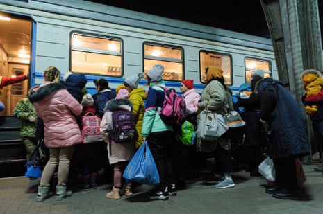 People are seen at Lviv railway station as they try to flee from Ukraine to Poland