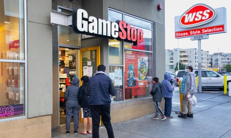 Customers waiting to enter video game retailer GameStop in Hollywood, California