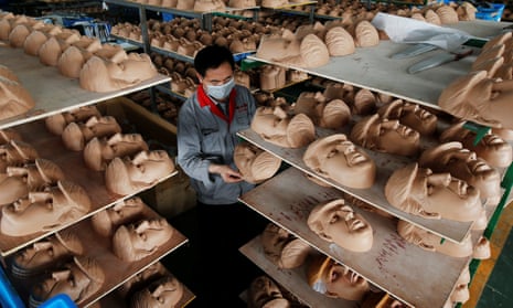 A factory producing Trump masks in Zhejiang province. ‘Both sides should try to be friends and partners, rather than opponents or enemies,’ the Chinese foreign ministry said.