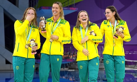 Australia’s Mollie O’Callaghan, Emma McKeon, Chelsea Hodges and Kaylee McKeowen celebrate with their gold medals in the women’s 4 x 100m medley relay final.