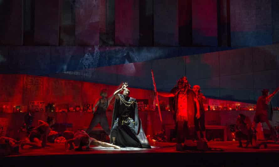 A red-lit stage in Antigone