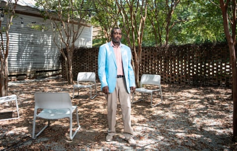 man in a blue blazer in a garden