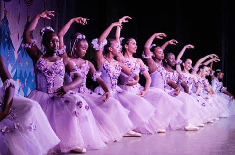 Ballerinas in a line holding a pose