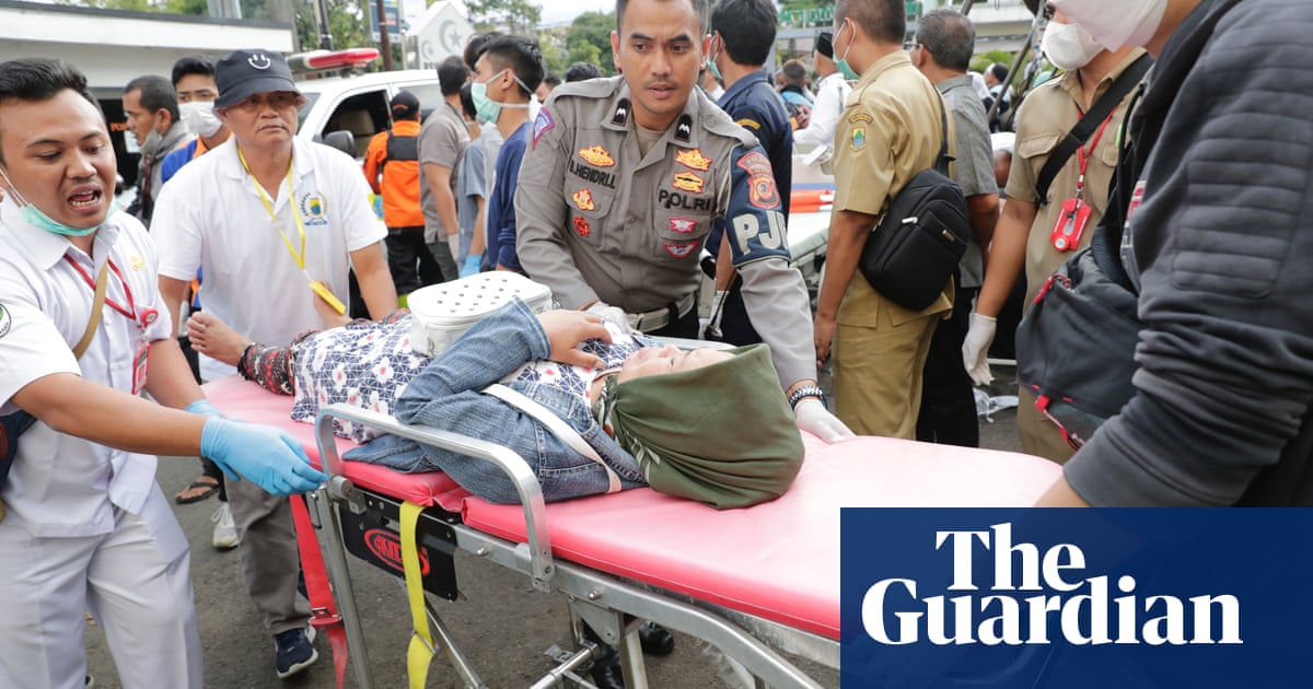 Indonesian earthquake: rescuers search for survivors trapped in rubble