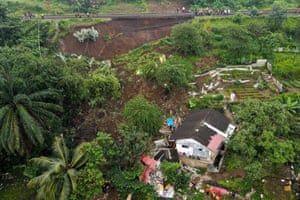 An evacuation effort by a rescue team to find victims buried in a landslide that was triggered by heavy rainfall in Bogor, Indonesia