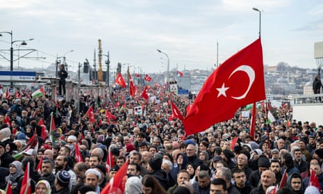 Thousands demonstrate to show solidarity with the Palestinian people on the Galata Bridge in Istanbul.