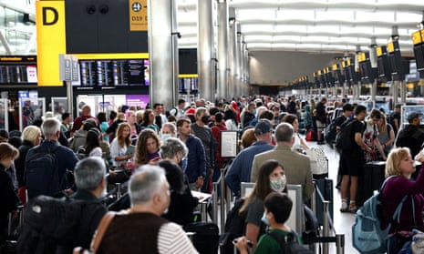 Passengers queue inside the departures area of Terminal 2 at Heathrow airport.