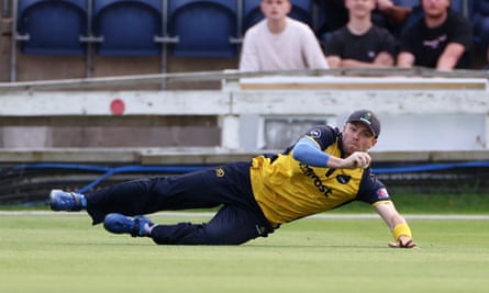 Dan Douthwaite with a catch off Michael Burgess.