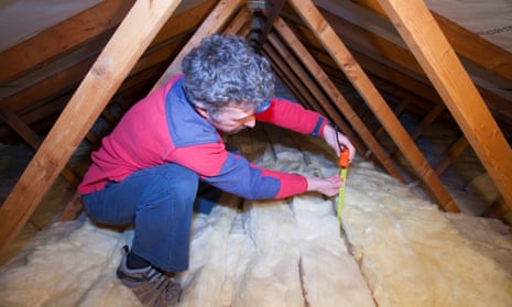 Homeowner measuring insulation depth